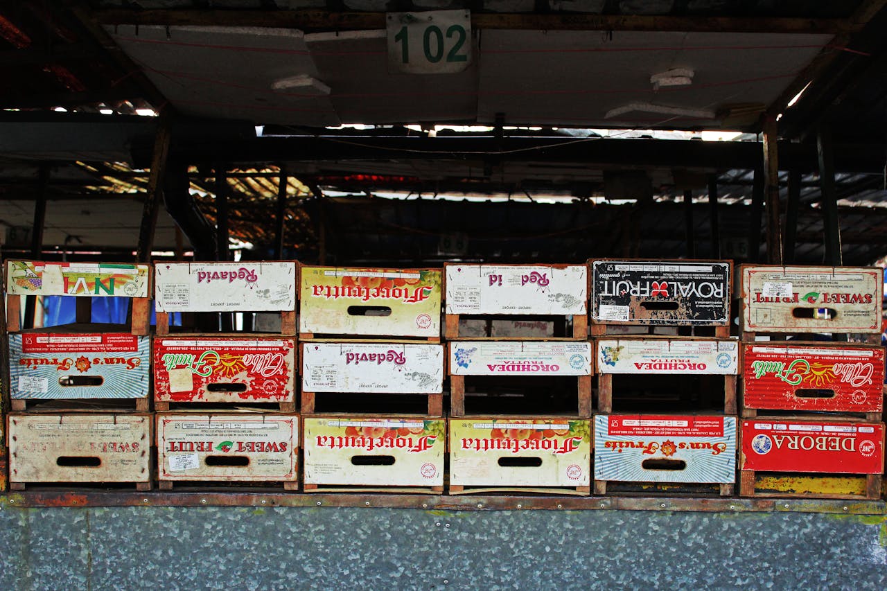 Stack of vibrant wooden crates at a Belgrade market showcasing retro design.